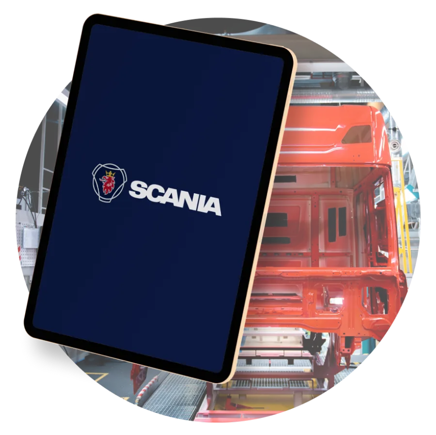 Scania Quality Gate: tablet interface in front of a truck cab on the assembly line